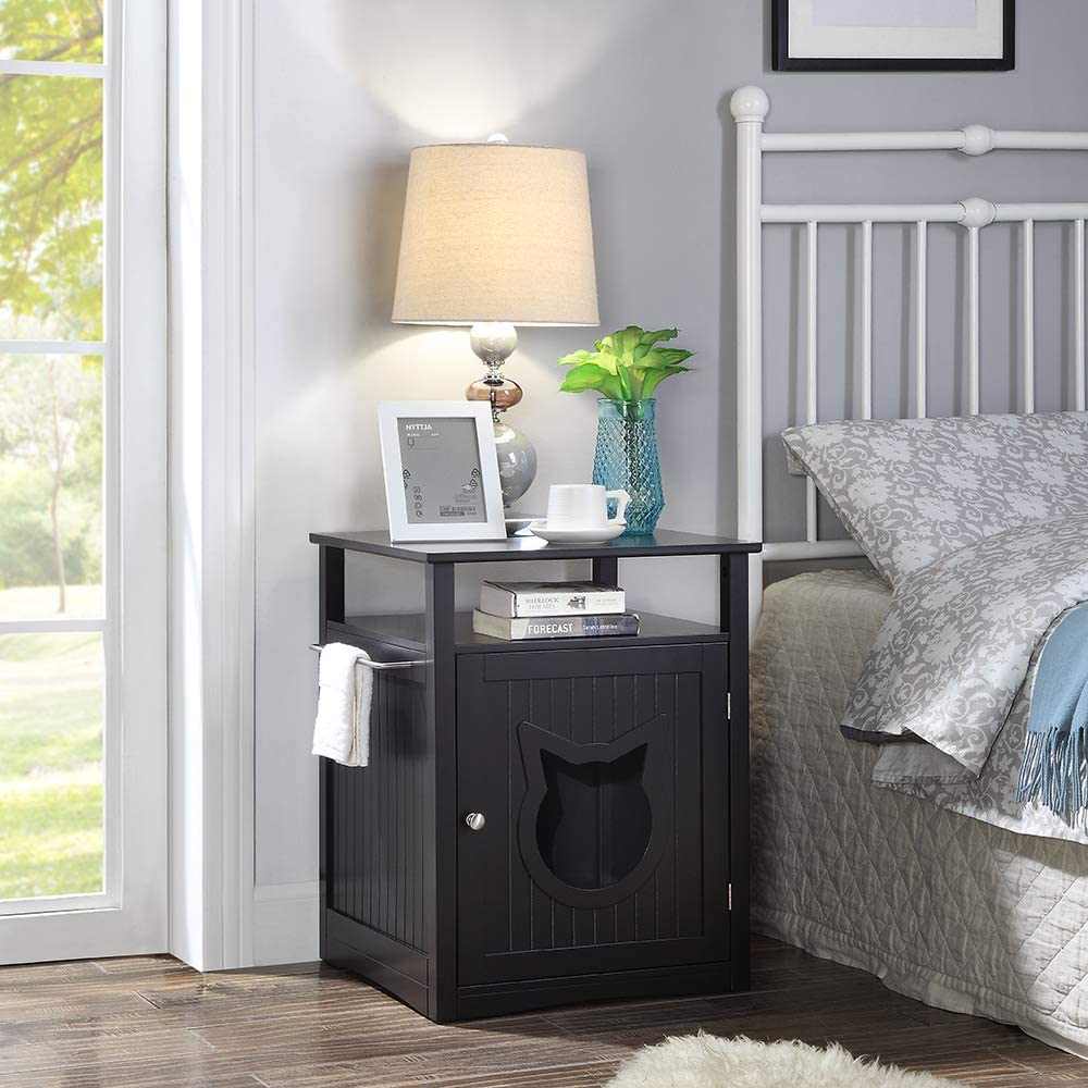 Stylish nightstand pet house doubling as litter box furniture with dual cat entry openings