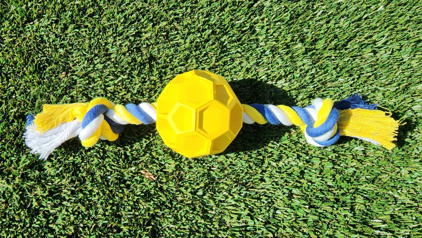 Durable rubber soccer ball chew toy with tug rope for active dogs